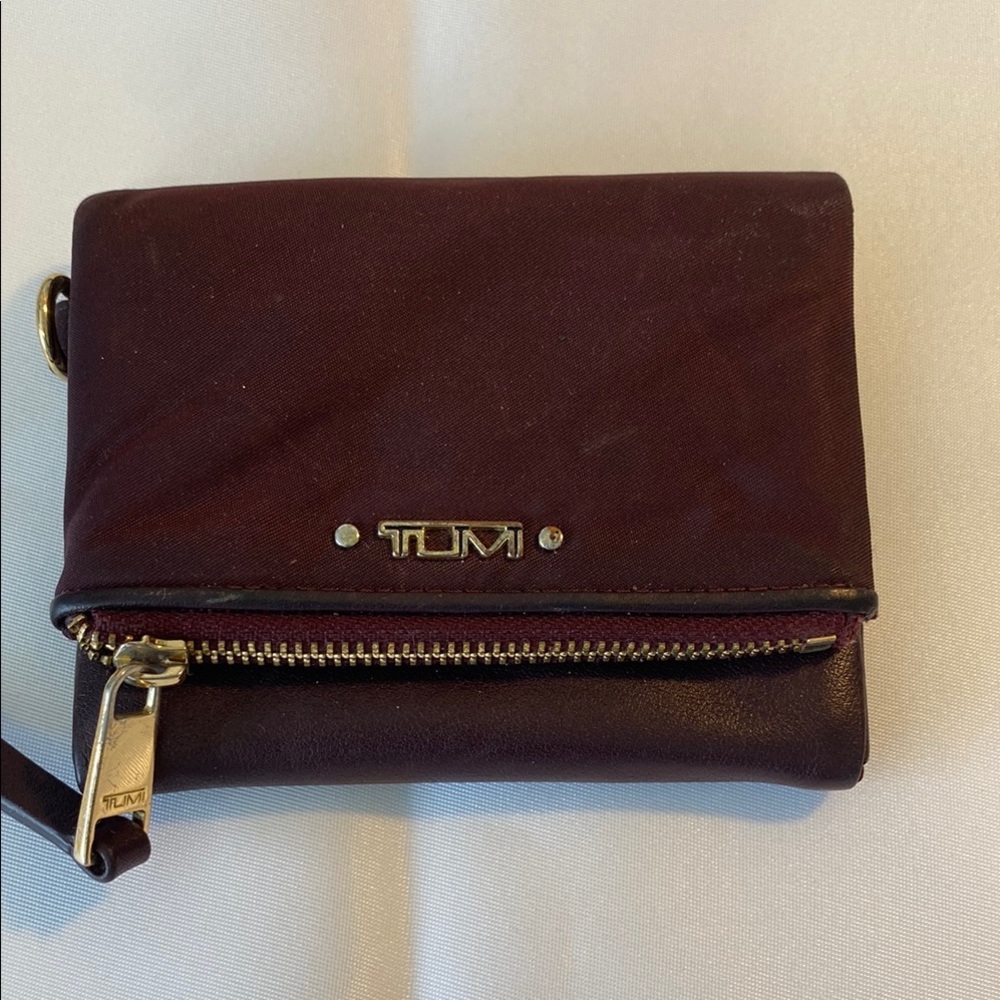 TUMI Dark Red Leather Wallet with Gold Accents